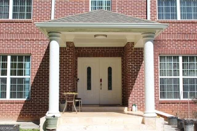 property entrance with a patio