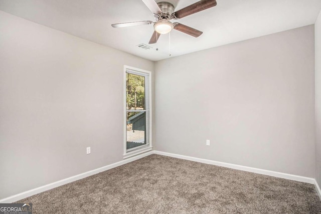 empty room featuring carpet floors and ceiling fan