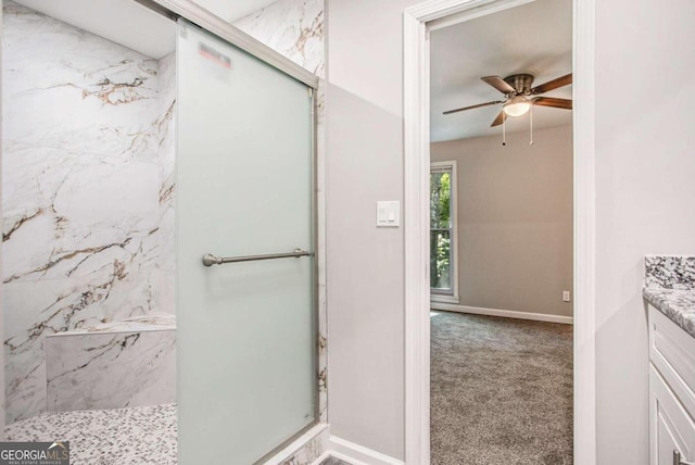 bathroom with vanity, a shower, and ceiling fan