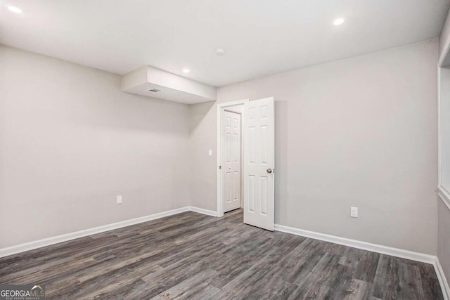 spare room featuring dark hardwood / wood-style floors