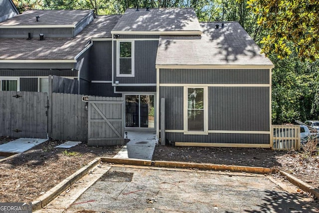 back of property with a patio