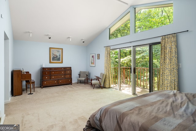 bedroom with access to exterior, multiple windows, high vaulted ceiling, and light colored carpet