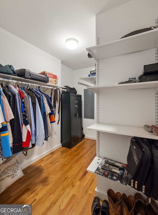 walk in closet featuring light hardwood / wood-style flooring