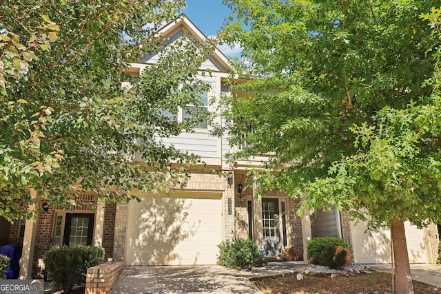 obstructed view of property with a garage