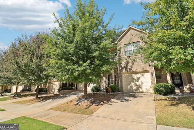 obstructed view of property with a garage