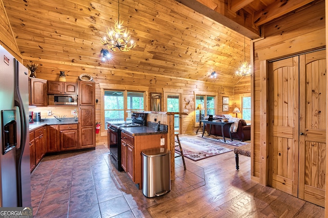 kitchen with a kitchen island, a breakfast bar area, stainless steel appliances, decorative light fixtures, and dark hardwood / wood-style flooring