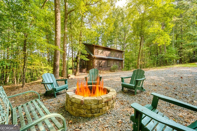 view of patio / terrace featuring an outdoor fire pit