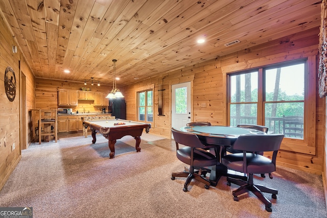 rec room featuring light carpet, wood walls, and wood ceiling