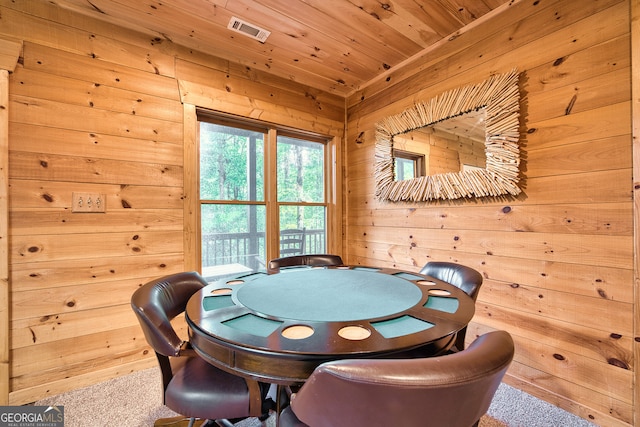 playroom with wood ceiling, wooden walls, and carpet