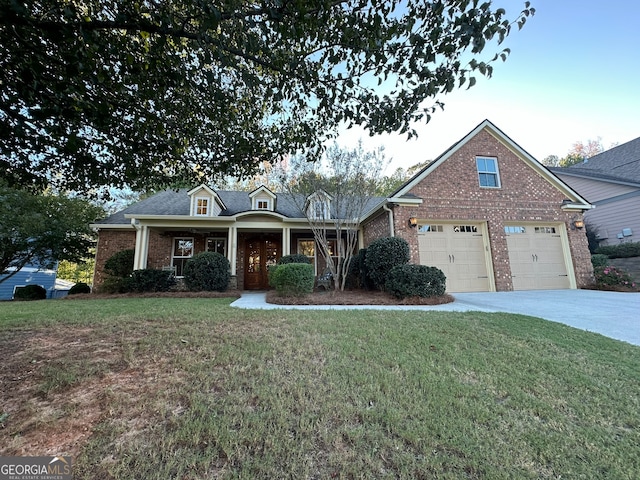 view of front of home with a front lawn and a garage