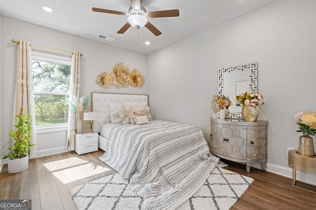 bedroom featuring hardwood / wood-style floors and ceiling fan