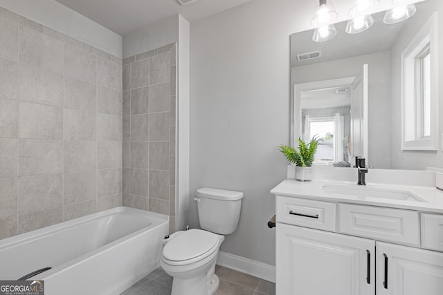 bathroom with vanity, toilet, and tile patterned floors