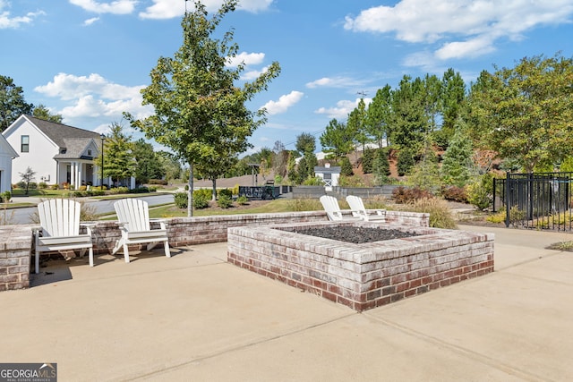 view of patio with a fire pit