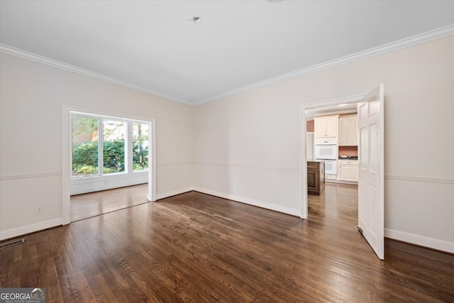 unfurnished room with ornamental molding and dark wood-type flooring