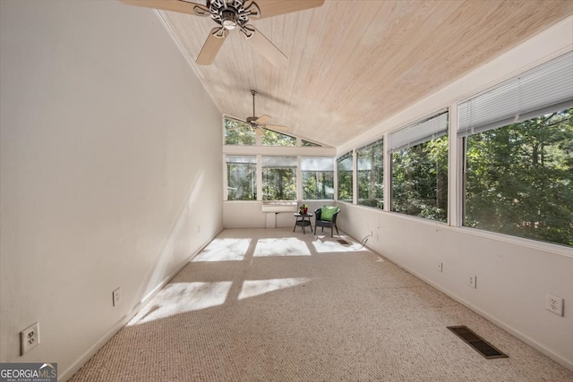 unfurnished sunroom with ceiling fan, wooden ceiling, and vaulted ceiling