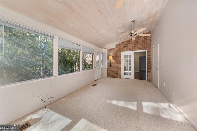 unfurnished sunroom with lofted ceiling, wooden ceiling, and ceiling fan