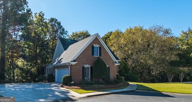 view of side of property with a yard and a garage