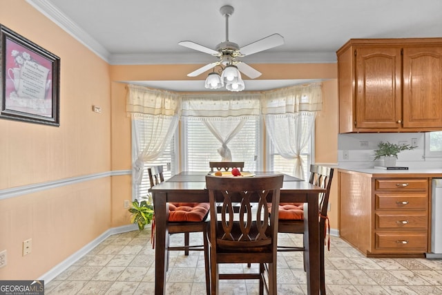 dining space featuring crown molding and ceiling fan