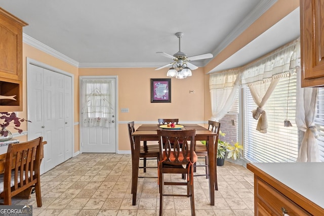 dining room with ornamental molding, ceiling fan, and a wealth of natural light