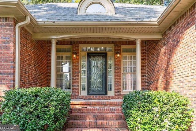 entrance to property featuring a porch