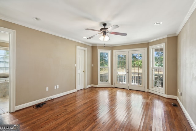 spare room featuring crown molding, hardwood / wood-style flooring, french doors, and ceiling fan