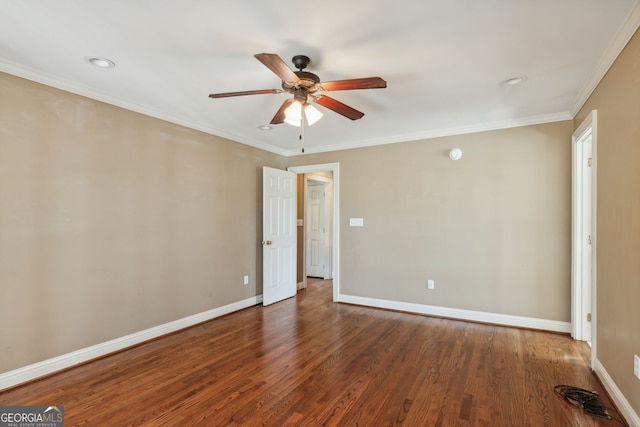 empty room with ornamental molding, ceiling fan, and dark hardwood / wood-style flooring