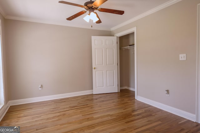 1201 Keencheefoonee Rd, Rutledge, GA 30663 - unfurnished bedroom featuring a ceiling fan, ornamental molding, light wood-type flooring, a closet, and baseboards