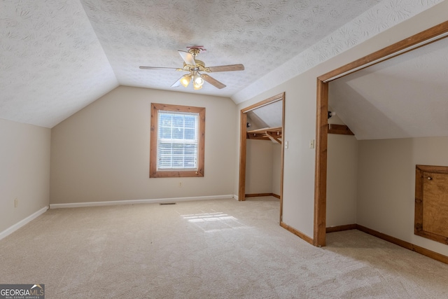 1201 Keencheefoonee Rd, Rutledge, GA 30663 - bonus room featuring a textured ceiling, vaulted ceiling, baseboards, ceiling fan, and carpet floors