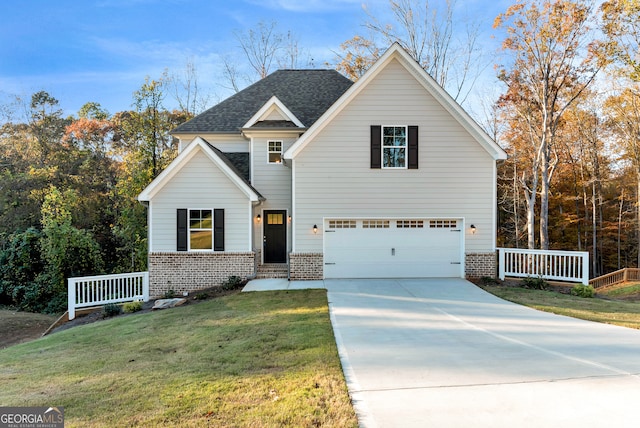 view of front facade with a garage and a front yard