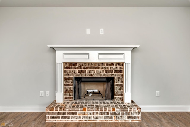 interior details with a fireplace and hardwood / wood-style flooring