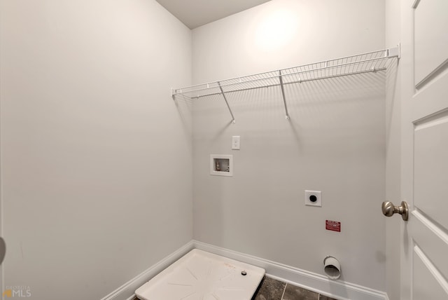 clothes washing area featuring hookup for an electric dryer, washer hookup, and tile patterned floors