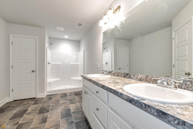 bathroom featuring vanity and walk in shower