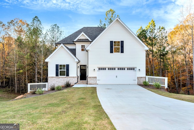 view of front of home featuring a garage and a front yard