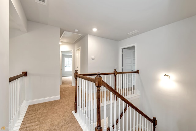 corridor with light colored carpet