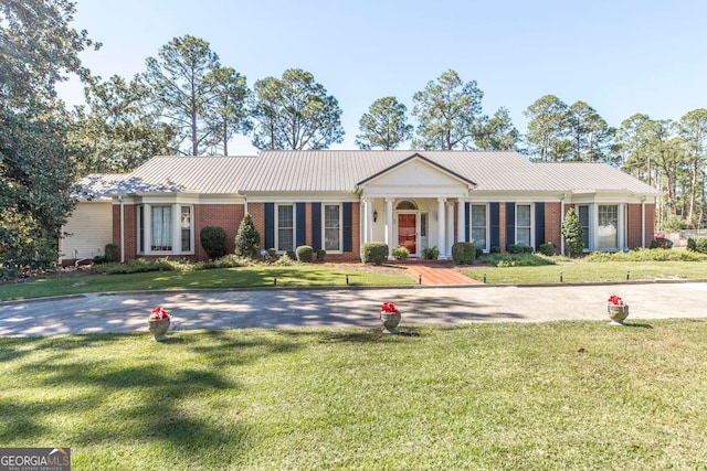 ranch-style house with a front lawn