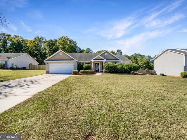 view of front facade featuring a garage and a front lawn