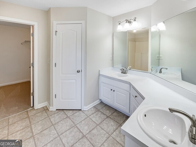 bathroom featuring vanity and tile patterned flooring