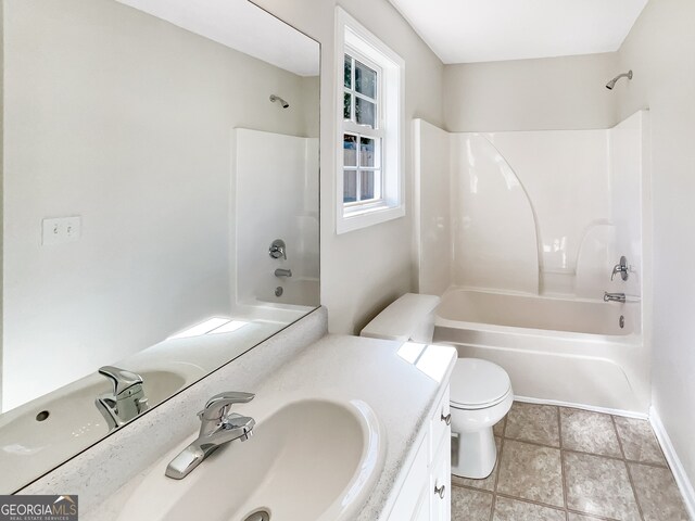 full bathroom featuring toilet, vanity, and shower / bathtub combination