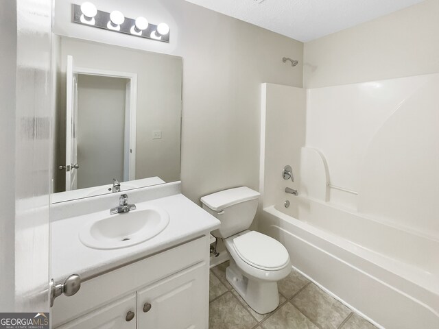 full bathroom with vanity, tile patterned flooring, toilet, and tub / shower combination