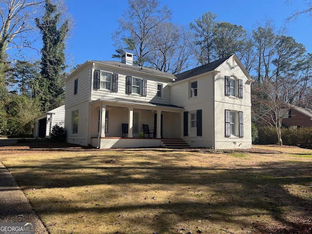 view of front property with a porch and a front lawn