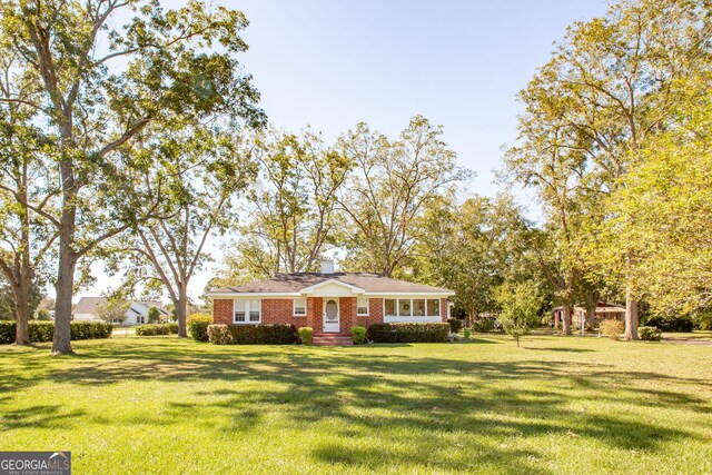 5605 Ga Highway 121, Blackshear, GA 31516 - view of front facade with a front lawn and brick siding