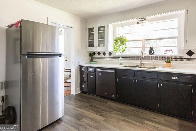 5605 Ga Highway 121, Blackshear, GA 31516 - kitchen featuring freestanding refrigerator, a sink, dishwasher, tasteful backsplash, and crown molding