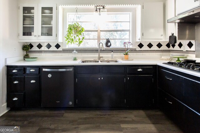 5605 Ga Highway 121, Blackshear, GA 31516 - kitchen with dishwashing machine, a sink, under cabinet range hood, black gas stovetop, and dark cabinetry