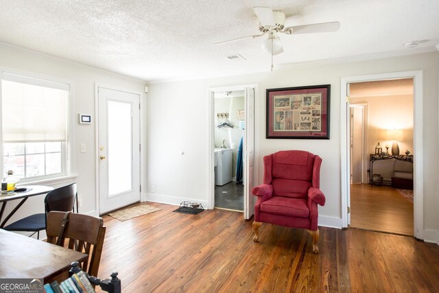 5605 Ga Highway 121, Blackshear, GA 31516 - living room with hardwood / wood-style floors, ornamental molding, a ceiling fan, washer / dryer, and baseboards