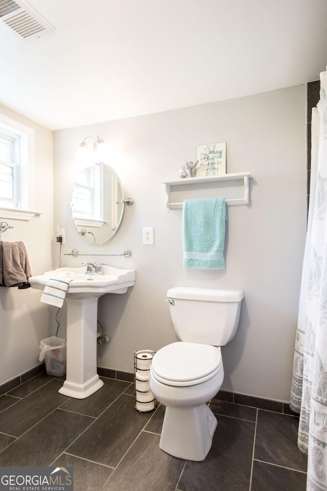 5605 Ga Highway 121, Blackshear, GA 31516 - full bathroom featuring toilet and baseboards