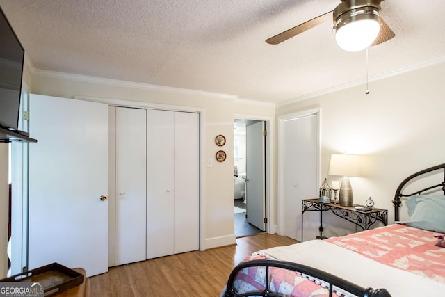 5605 Ga Highway 121, Blackshear, GA 31516 - bedroom featuring ornamental molding, wood finished floors, a closet, a textured ceiling, and ceiling fan