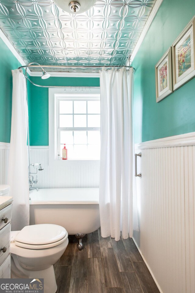 5605 Ga Highway 121, Blackshear, GA 31516 - full bathroom featuring wainscoting, wood finished floors, toilet, and an ornate ceiling
