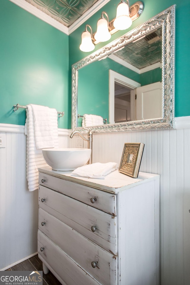 5605 Ga Highway 121, Blackshear, GA 31516 - bathroom with wainscoting, vanity, ornamental molding, and an ornate ceiling