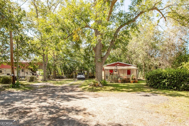5605 Ga Highway 121, Blackshear, GA 31516 - view of front facade with a carport and driveway
