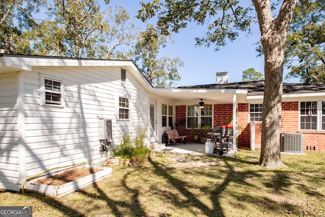 5605 Ga Highway 121, Blackshear, GA 31516 - back of property with ceiling fan, brick siding, a yard, and a patio area